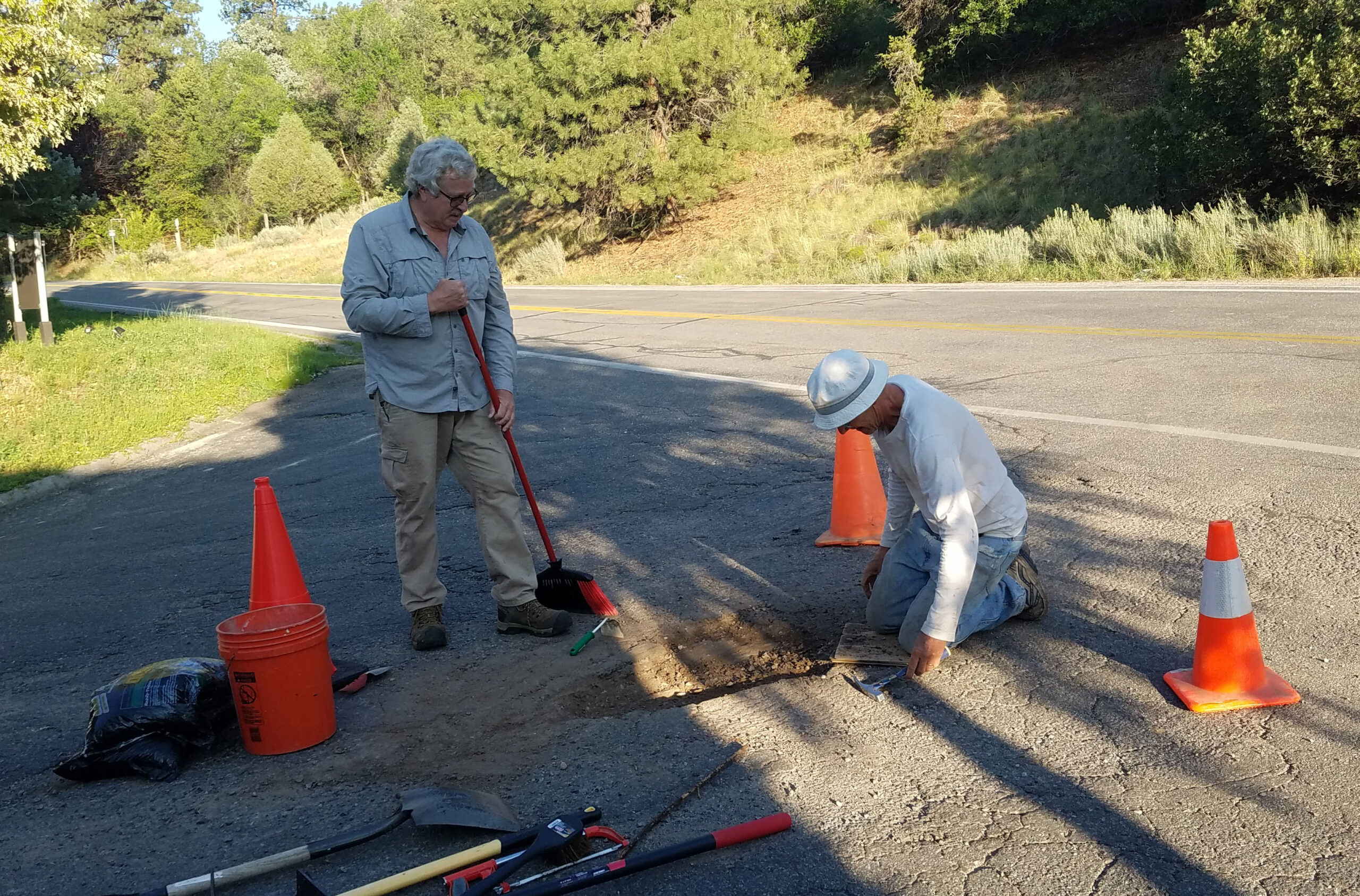 Volunteer fixing potholes